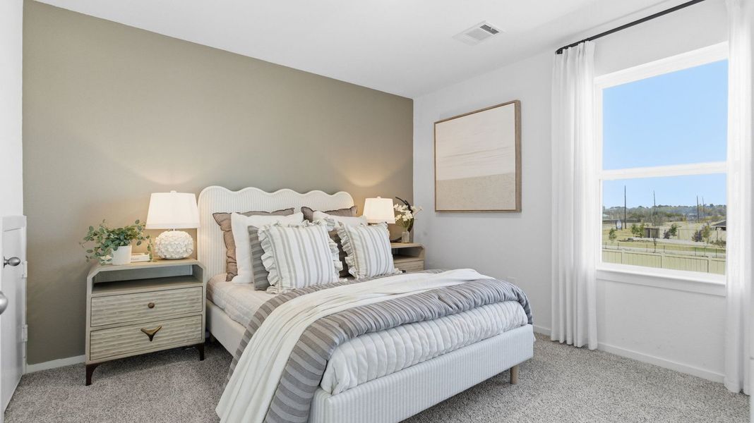 Furnished interior in a model home at Caldwell Crossing in Iowa Colony (Image 22).