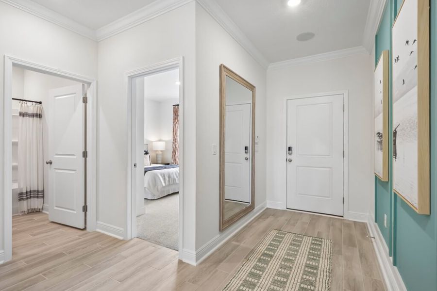 Furnished interior in a model home at Mahogany At Jubilee in Pace (Image 4).