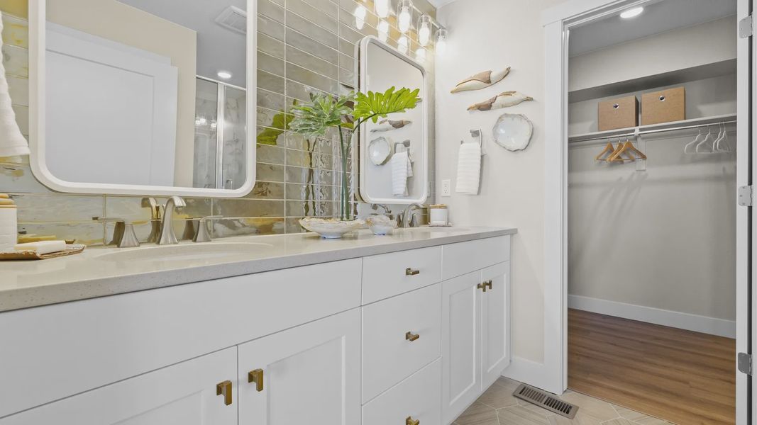 Step into luxury with Dillon Pointe's bathroom, featuring designer tile wall and refined fixtures. Step into luxury with Dillon Pointe's bathroom, featuring designer tile wall and refined fixtures.