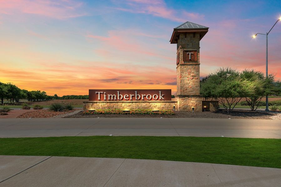 Entrance to the Timberbrook community in Justin, TX, featuring signage and landscaping (Image 1). Entrance to the Timberbrook community in Justin, TX, featuring signage and landscaping (Image 1).