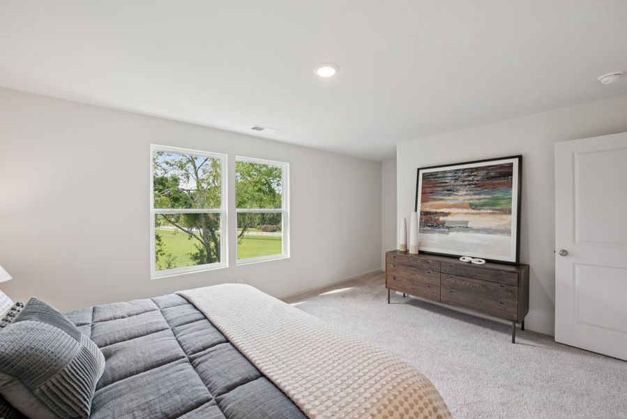 A room with a bed and a window.