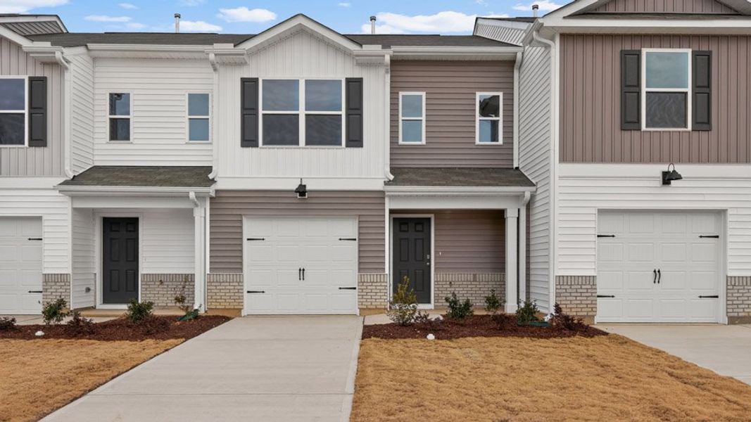 Front exterior of a home in the The Townes at Honeycutt Oaks community, located in Angier, NC (Image 13).