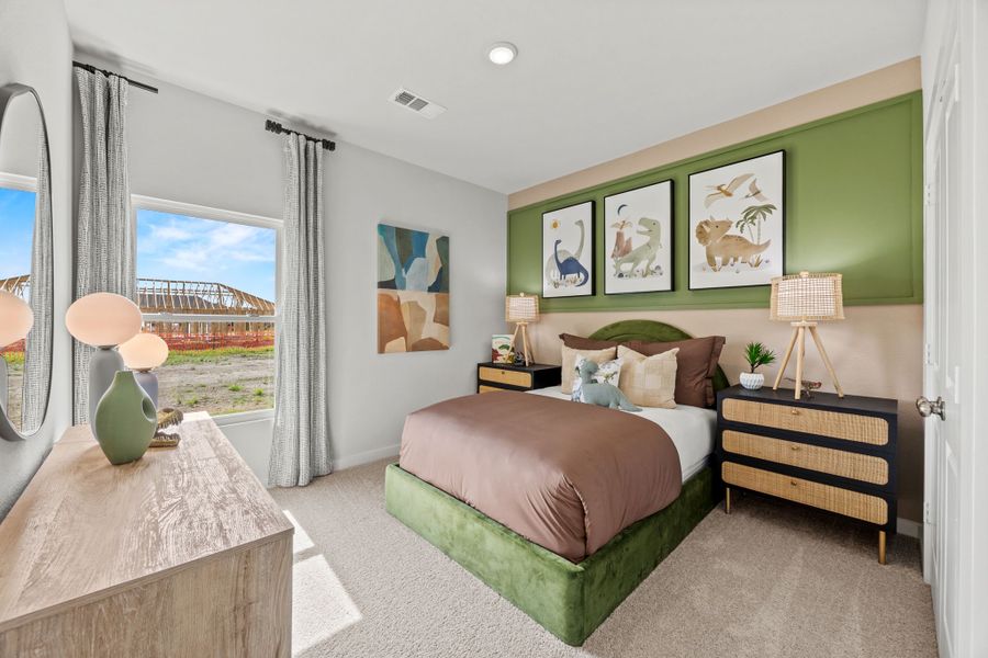 A bedroom with a large window. A bedroom with a large window.