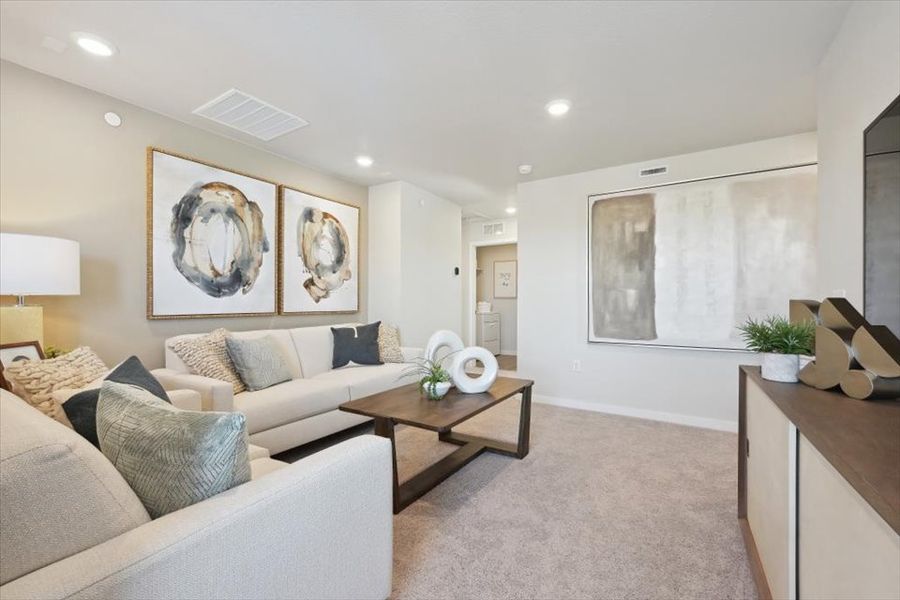 A living room with a couch and a coffee table.