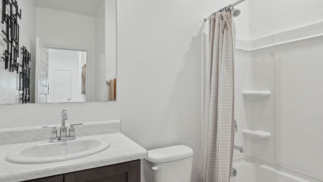 Furnished interior in a model home at Elena Trails in Maricopa (Image 20).