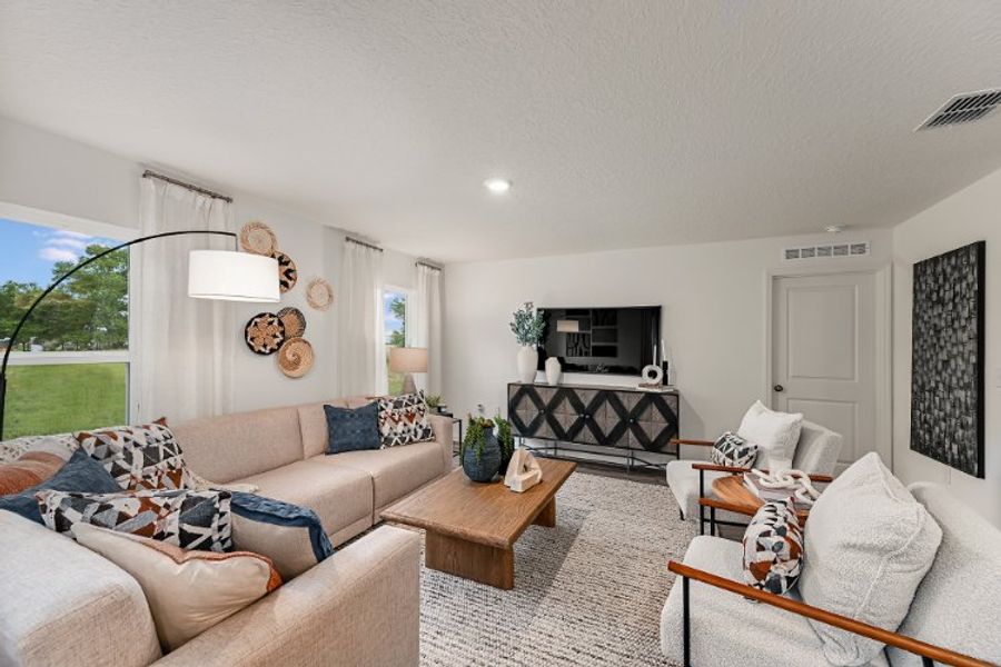A living room with a fireplace. A living room with a fireplace.