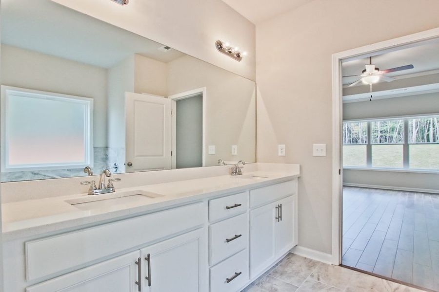 Furnished interior in a model home at Rockwell Farms in Winder (Image 7).