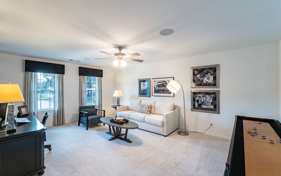 Furnished interior in a model home at Infinity Square in Kyle (Image 10).