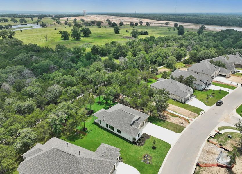 Aerial view of the The Colony- Pine Cove community in Bastrop, TX, showing layout and nearby surroundings (Image 1). Aerial view of the The Colony- Pine Cove community in Bastrop, TX, showing layout and nearby surroundings (Image 1).