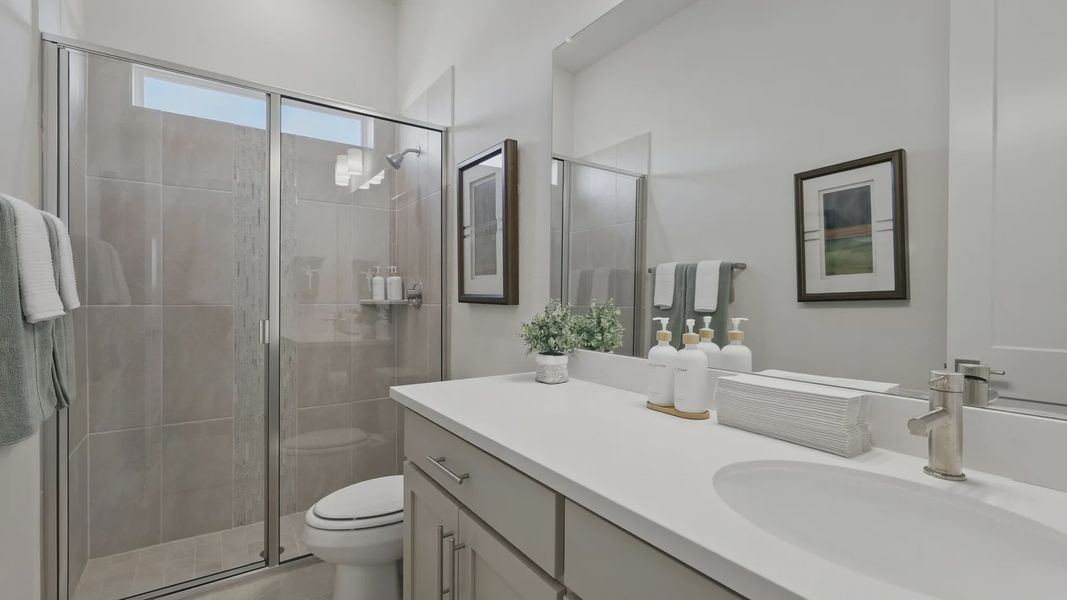 Luxuriously designed with a pristine white vanity and sleek glass shower at Rio Vista, Kelly Ranch. Luxuriously designed with a pristine white vanity and sleek glass shower at Rio Vista, Kelly Ranch.