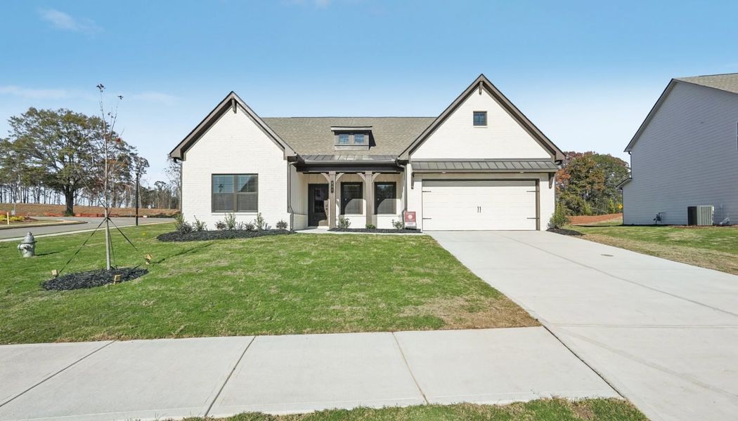 Front exterior of a home in the Ponderosa Farms Reserve community, located in Gainesville, GA (Image 12).