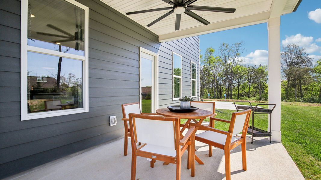 Outdoor living at its finest with covered seating are with fan