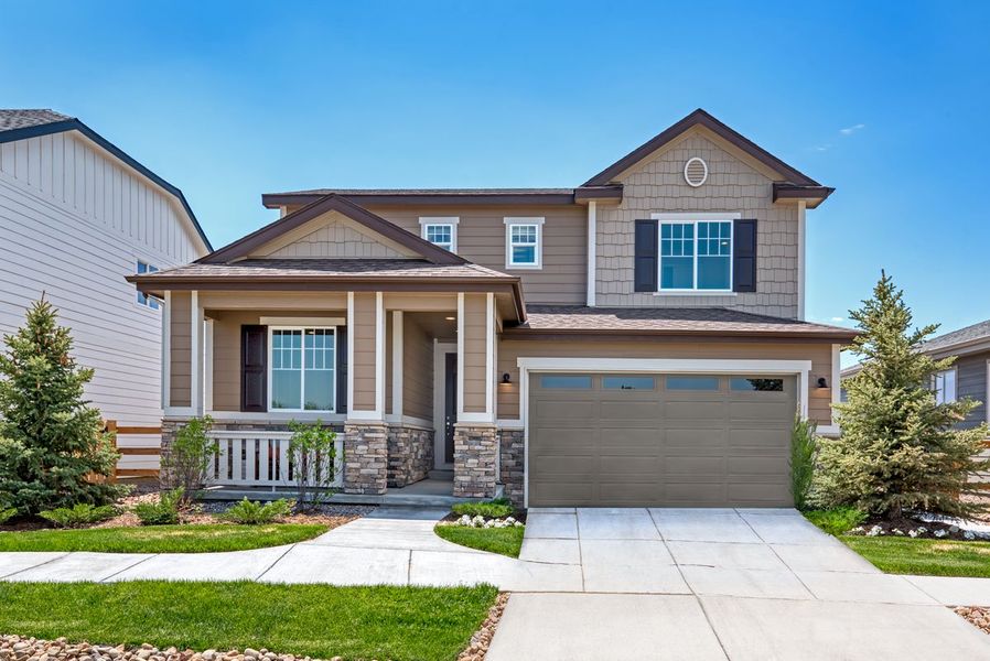 Front exterior of a home in the The Trails at Aspen Ridge community, located in Colorado Springs, CO (Image 1).
