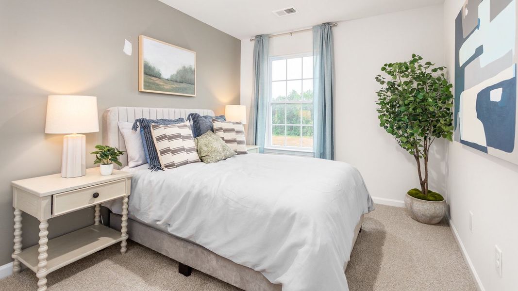 Furnished interior in a model home at North Village Townes in Greensboro (Image 27).