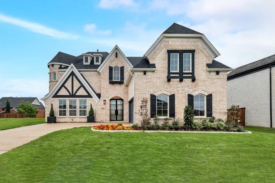 Front exterior of a home in the Creekside at Elevon community, located in Lavon, TX (Image 1).