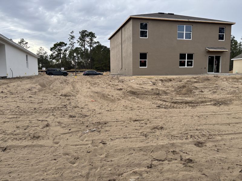 A modern, under-construction home with a simple facade in Lake Diamond by D.R. Horton, Ocala, FL.