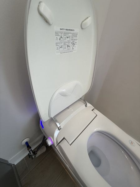 A modern bidet toilet with advanced features and safety instructions, offering a sleek and functional bathroom upgrade. A modern bidet toilet with advanced features and safety instructions, offering a sleek and functional bathroom upgrade.