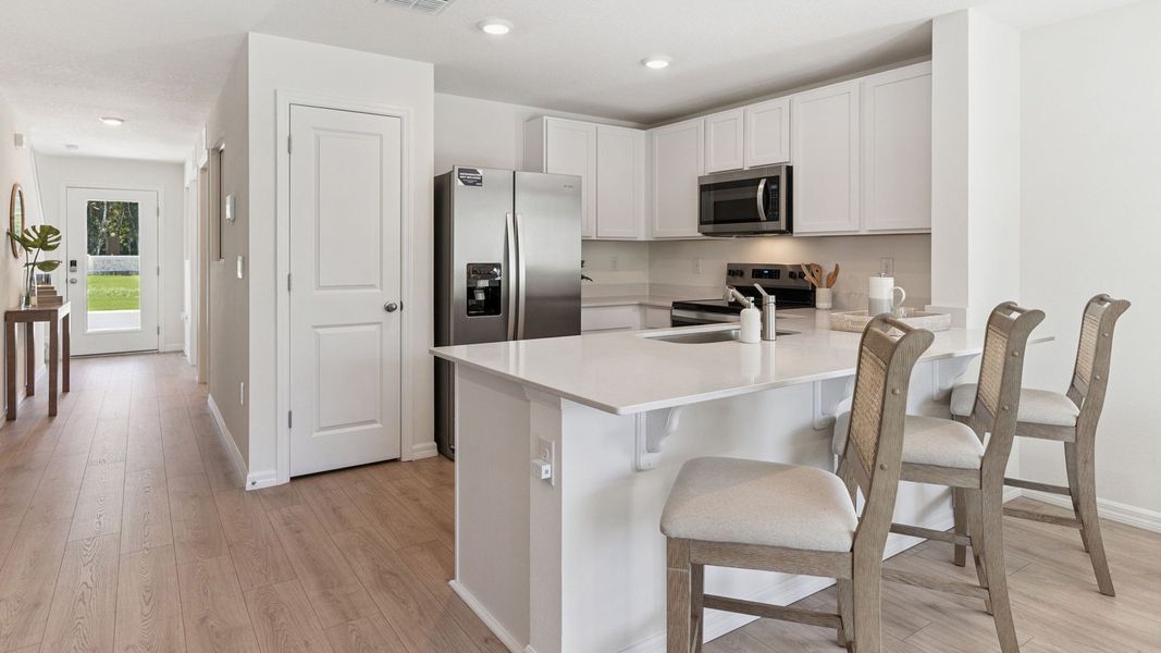 Furnished interior in a model home at The Vineyards Townhomes in Holly Hill (Image 6).