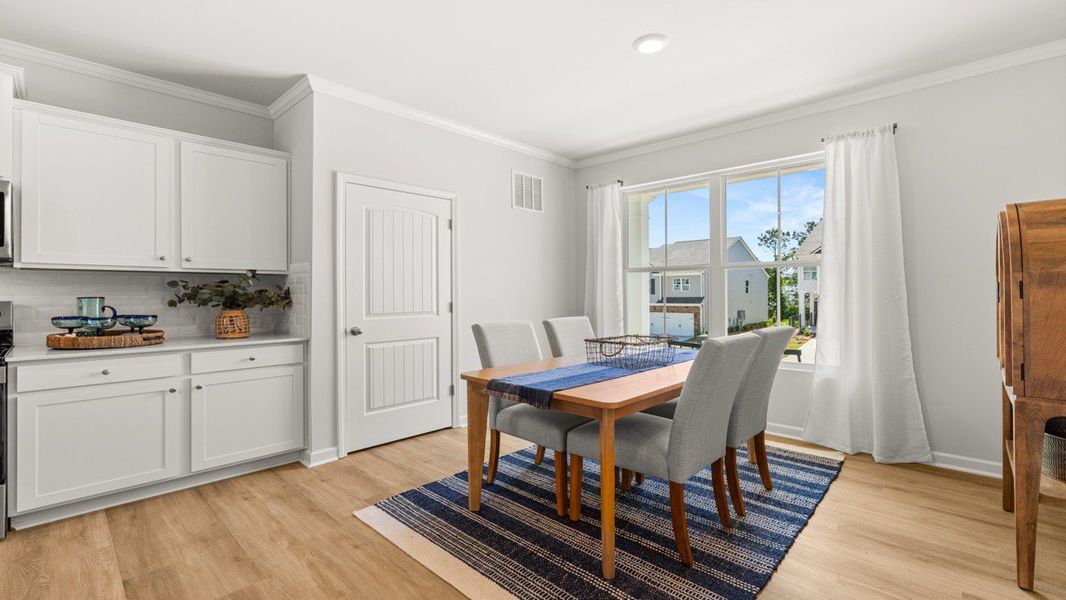 Furnished interior in a model home at Waypoint in Flowery Branch (Image 8).