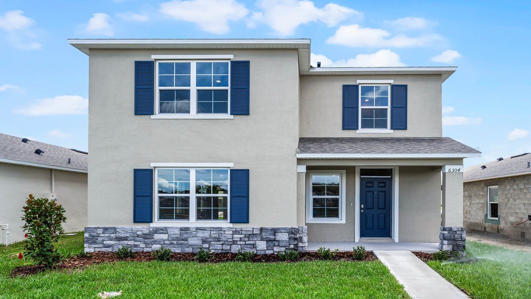 Front exterior of a home in the Kindred community, located in Kissimmee, FL (Image 27).