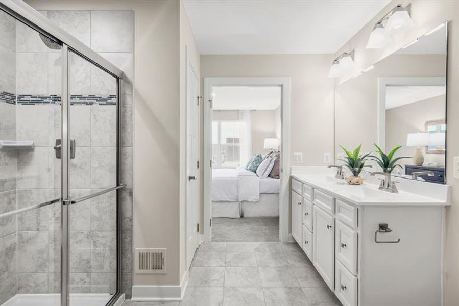 A SPA-INSPIRED OWNER'S BATH WITH MODERN STYLE AND DUAL VANITIES A SPA-INSPIRED OWNER'S BATH WITH MODERN STYLE AND DUAL VANITIES