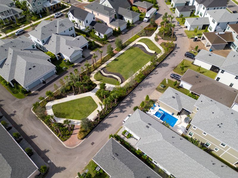 Aerial view of the Newfield community in Palm City, FL, showing layout and nearby surroundings (Image 1). Aerial view of the Newfield community in Palm City, FL, showing layout and nearby surroundings (Image 1).