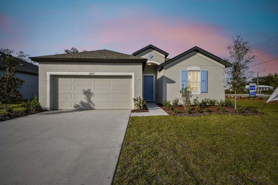 Front exterior of a home in the Lanier Acres community, located in Zephyrhills, FL (Image 9).