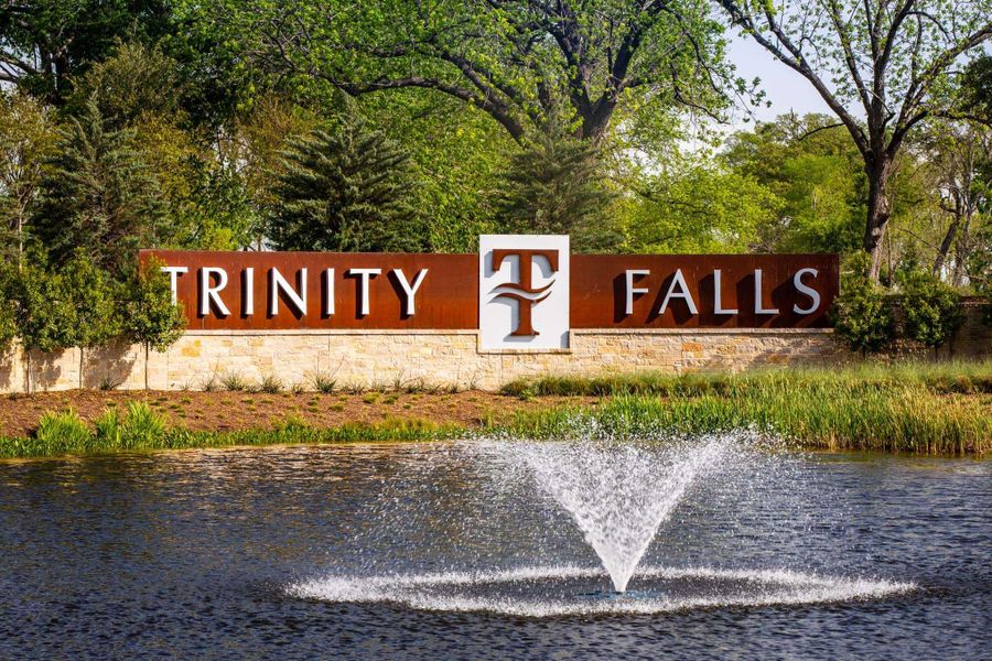 Entrance to the Trinity Falls community in McKinney, TX, featuring signage and landscaping (Image 2). Entrance to the Trinity Falls community in McKinney, TX, featuring signage and landscaping (Image 2).