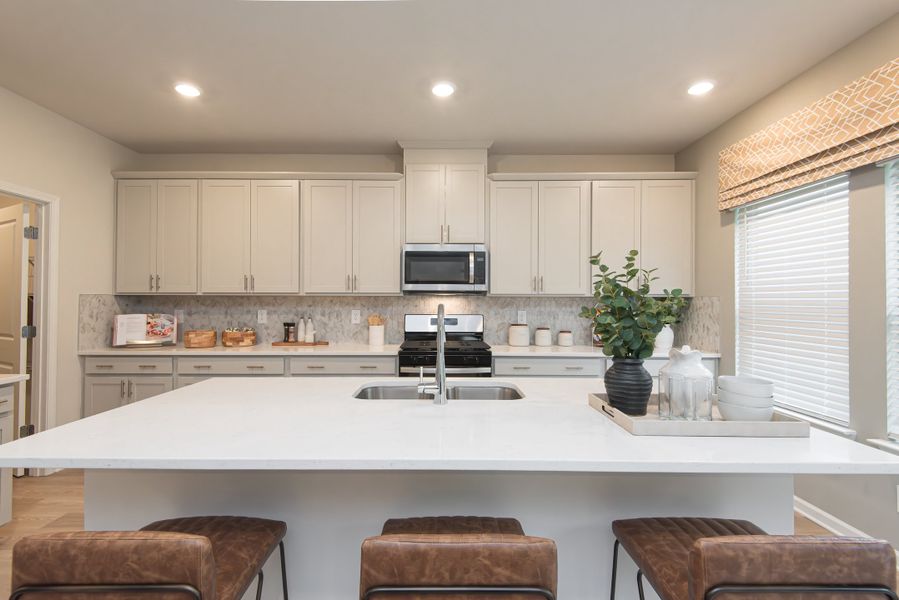 The beautiful granite countertop gives you ample space to prepare dinner or meal prep.