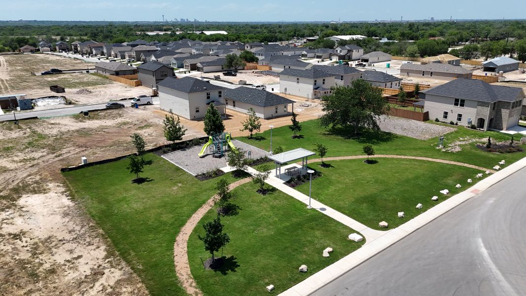 Family-friendly community park with lush lawns and playground in Spanish Trails by KB Home, San Antonio, TX. Family-friendly community park with lush lawns and playground in Spanish Trails by KB Home, San Antonio, TX.