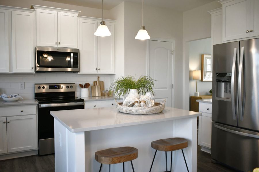 Furnished interior in a model home at Brassfield Meadows in Burlington (Image 7).