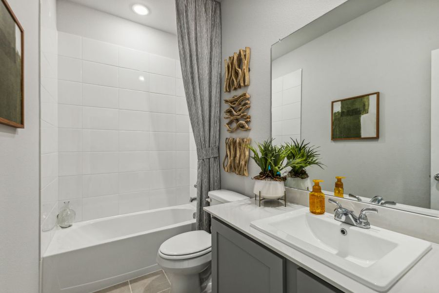 Bathroom in a Stonehaven new Turquoise home in Seagoville TX by Trophy Signature Homes – REPRESENTATIVE PHOTO