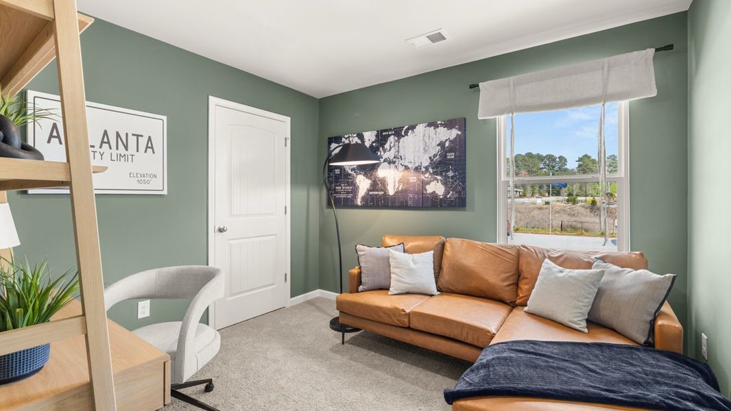 Furnished interior in a model home at Carlton in Douglasville (Image 16).