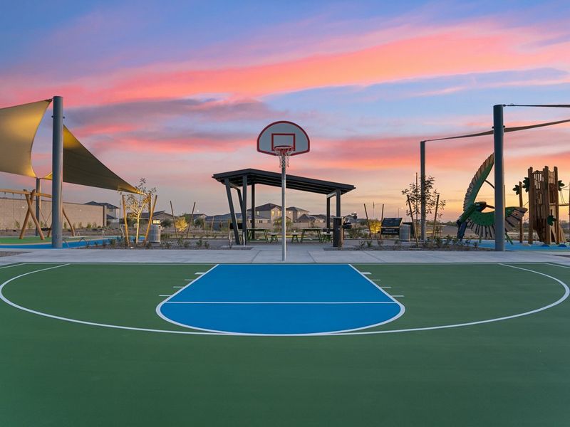 A basketball court with a basketball hoop. A basketball court with a basketball hoop.