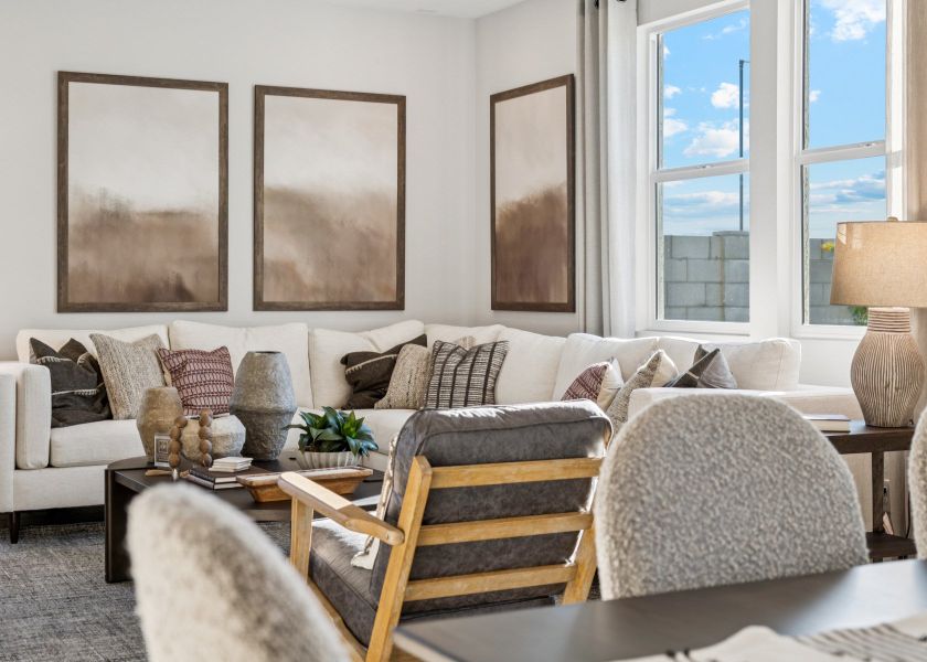 A living room with a couch and chairs.