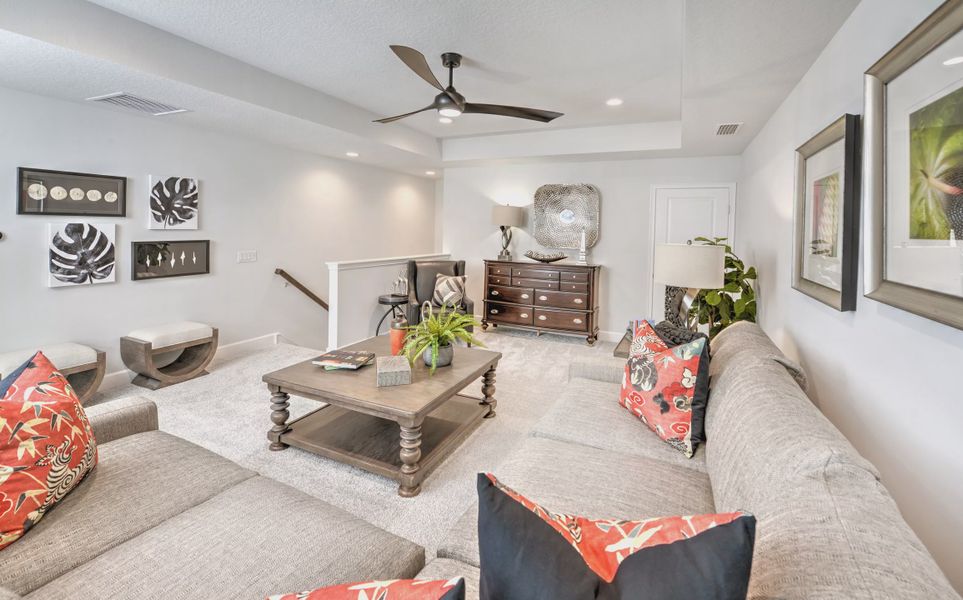 Furnished interior in a model home at Woodhaven Townhomes in Port Orange (Image 9).