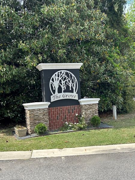 Entrance to the The Grove community in Florence, SC, featuring signage and landscaping (Image 2). Entrance to the The Grove community in Florence, SC, featuring signage and landscaping (Image 2).