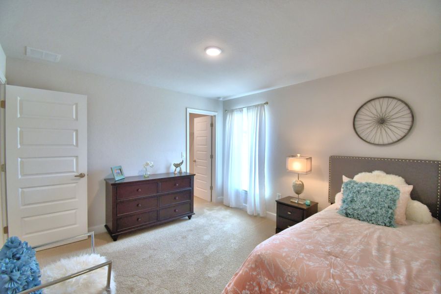 Furnished interior in a model home at Citrus Landing in Davenport (Image 38).