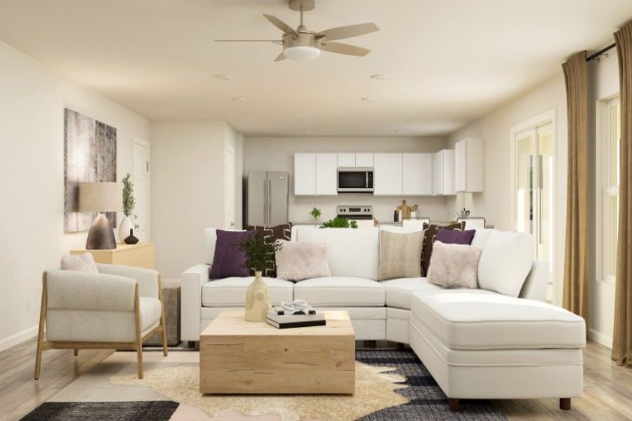 A living room with a white couch and a table. A living room with a white couch and a table.