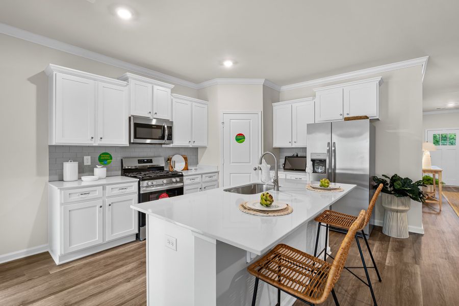 Furnished interior in a model home at Harmon Terrace in Hopkins (Image 13).
