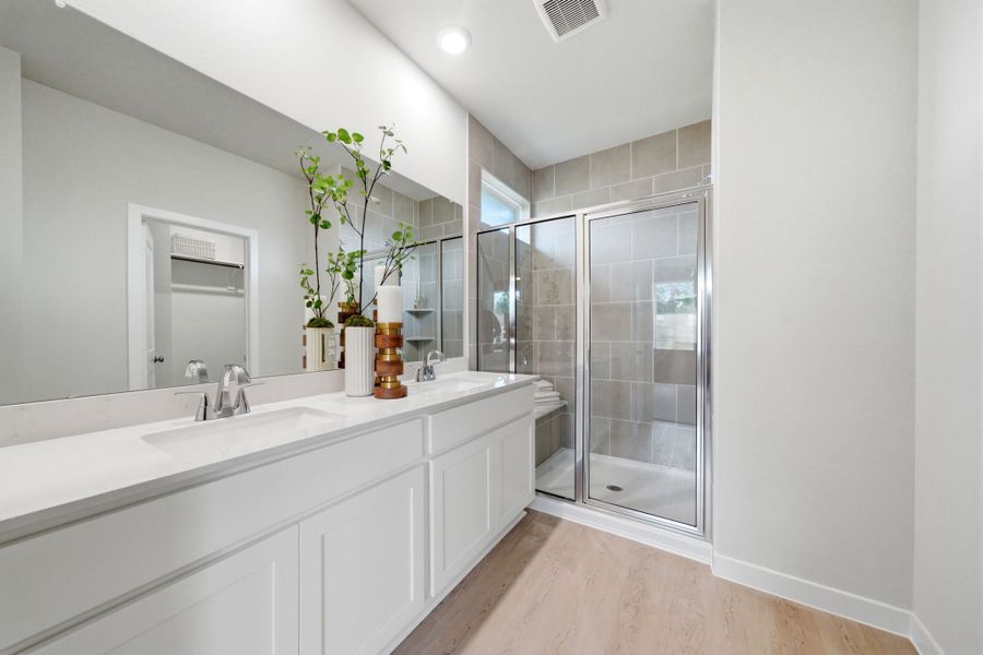 A bathroom with a glass shower.