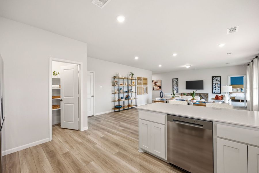 A kitchen with white cabinets. A kitchen with white cabinets.