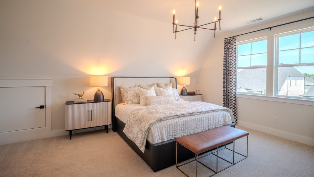 Bedroom with carpet and windows
