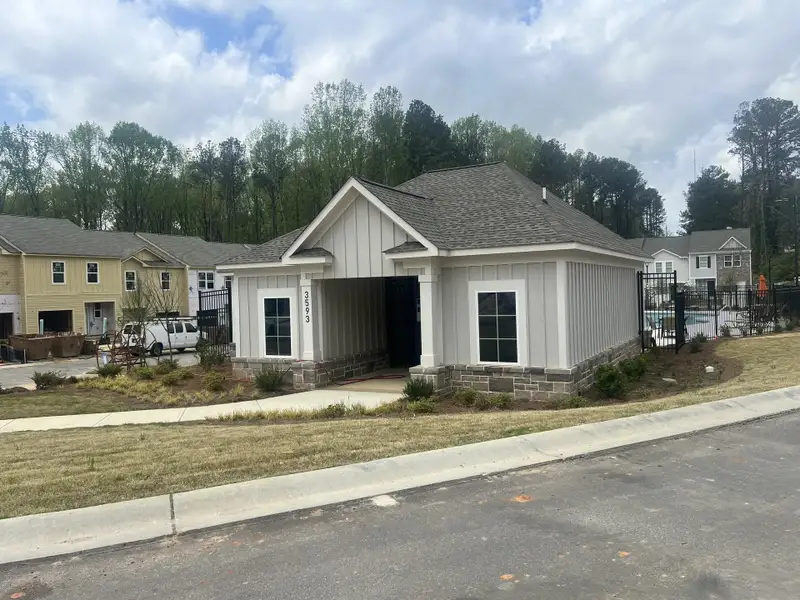 A charming modern home with a stone foundation in Aviary Park by Starlight Homes (Atlanta, GA).
