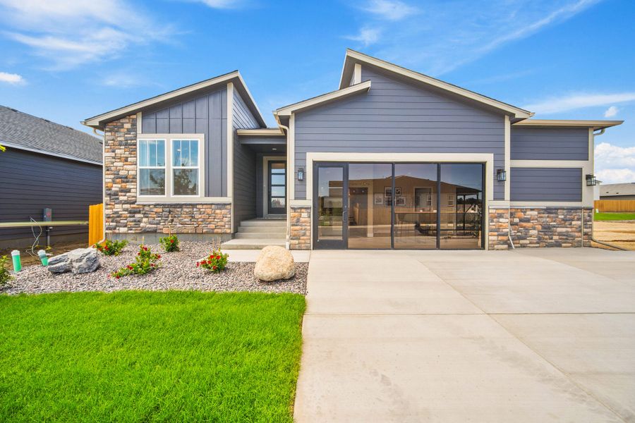 Front exterior of a home in the The Glen-12 community, located in Colorado Springs, CO (Image 1).