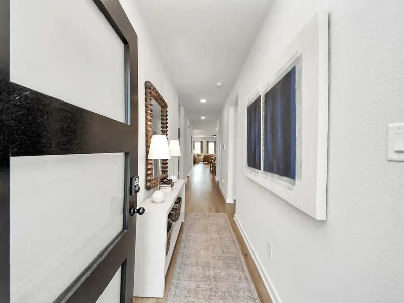 Furnished interior in a model home at Enclave at Newport in Crosby (Image 7).