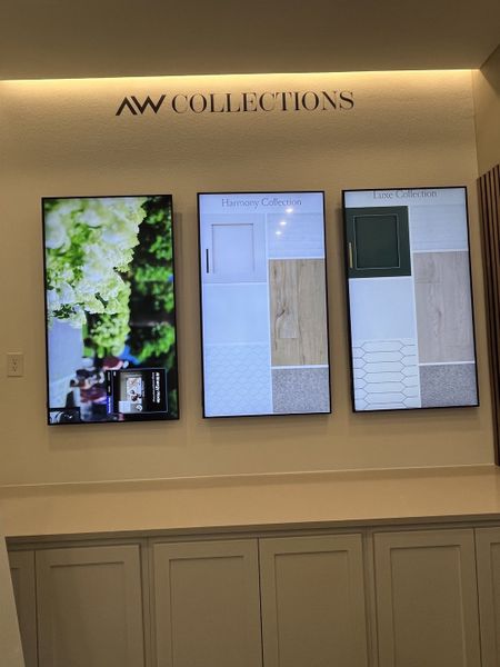 A modern display showcases the Harmony and Luxe collections with stylish cabinetry and flooring samples.