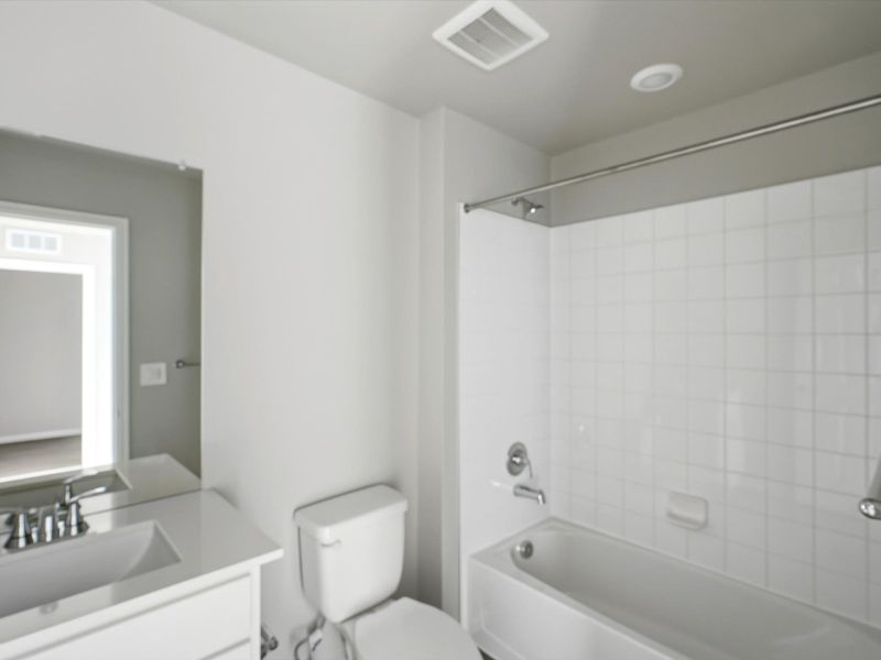 Furnished interior in a model home at York Station in Thornton (Image 6).