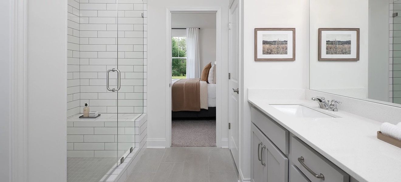 Furnished interior in a model home at Stewart's Glen | 55+ Community in Smyrna (Image 9).