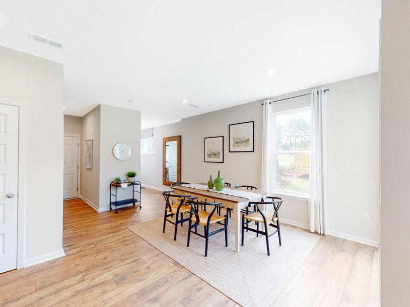 Furnished interior in a model home at Friendship Village Townhomes in Apex (Image 3).